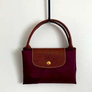 Longchamp
Le Pliage Large Travel Bag in Plum.